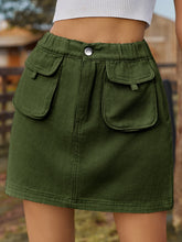 Denovelle dark green denim pocket mini skirt front view with button-up closure and flap pocket detail