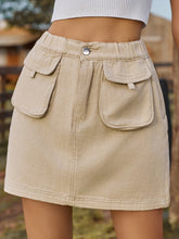 Denovelle Khaki denim pocket mini skirt front view with button-up closure and flap pocket detail