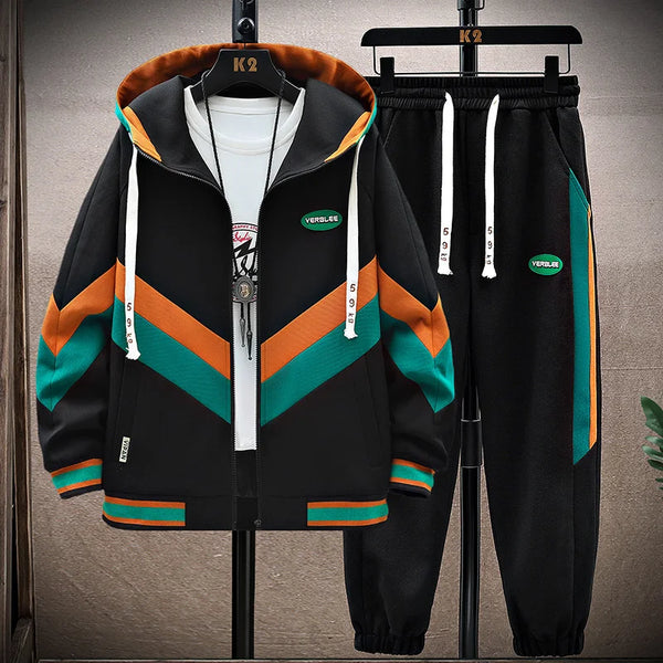 DravvenCore™ PatchFlux ContrastStitch Jogger Set black front view on hanger showing zigzag patchwork design