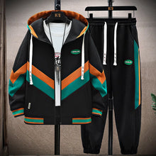 DravvenCore™ PatchFlux ContrastStitch Jogger Set black front view on hanger showing zigzag patchwork design