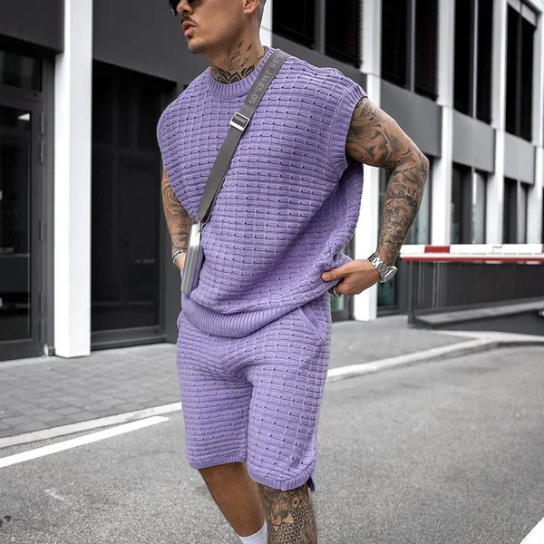 Man adjusting Dark Violet Draynoir FlexKnit shirt at airport in sleek travel-ready style.