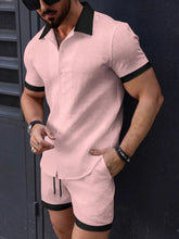 Front view of men's dusty pink dual-trim shirt and shorts set styled with sunglasses and accessories.