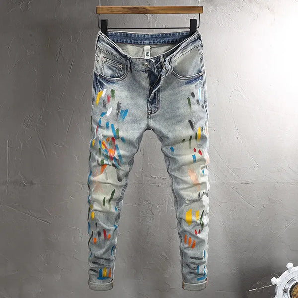 Front view of Drayven Edgewave Paint Splatter Distressed Jeans on hanger