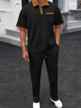 Black Drayven WaffleEdge Duo men’s set — front view featuring three-button polo with contrast trim and waffle-knit pants with front stitch crease