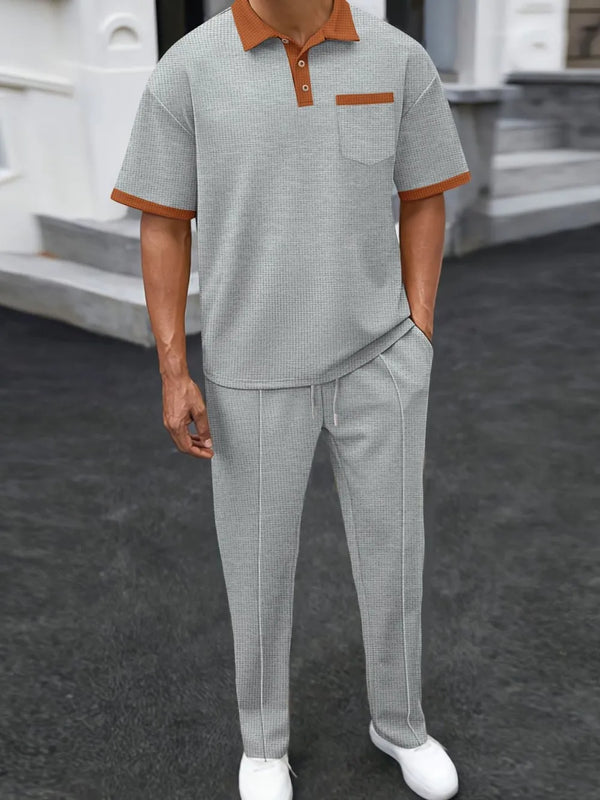 Gray Drayven WaffleEdge Duo men’s set — front view featuring three-button polo with contrast trim and waffle-knit pants with front stitch crease