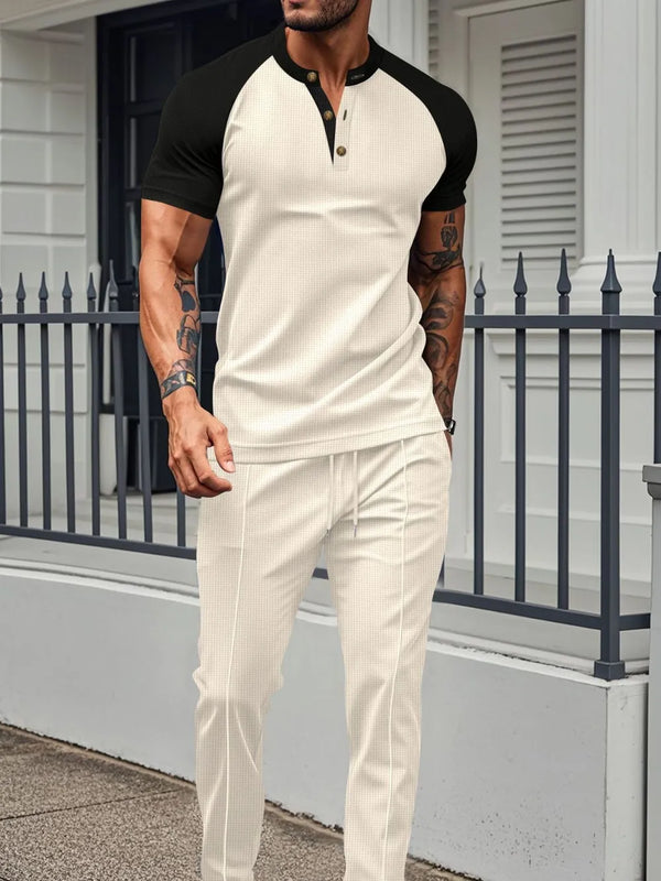 Men's beige Drennic ModFlex waffle-knit top and pants set with contrast trim, front walking view.