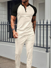 Men's beige Drennic ModFlex waffle-knit top and pants set with contrast trim, front walking view.