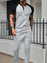 Men's gray Drennic ModFlex waffle-knit top and pants set with contrast trim, front walking view.