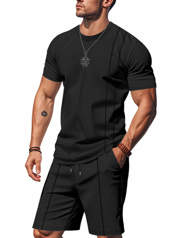 Man wearing black ModFlex set with vertical stripe, front view standing.