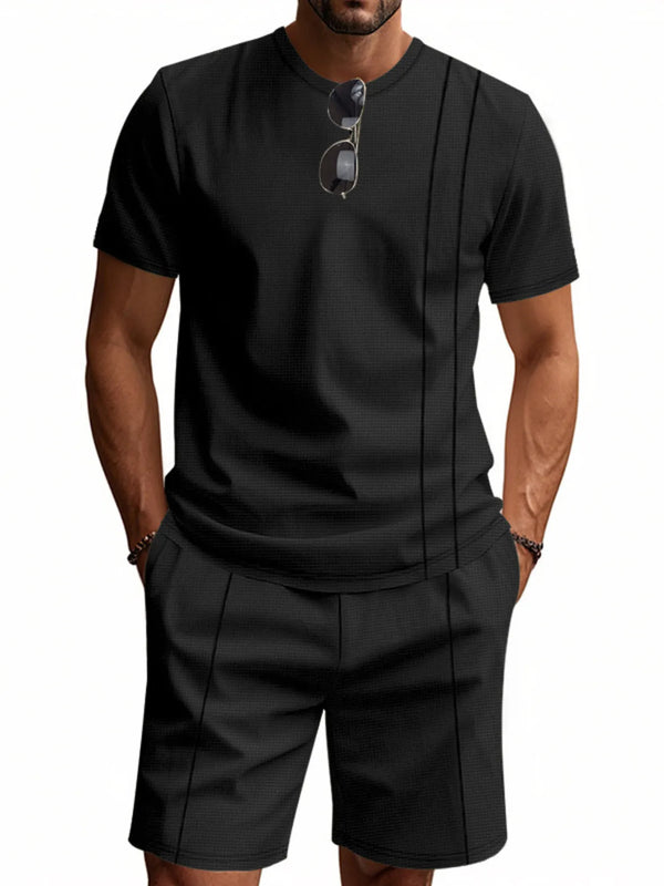 Close-up of black ModFlex set highlighting side pocket and front stripe detail, styled with glasses.