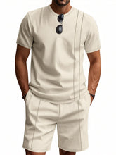 Plus size man in khaki ModFlex stripe set, front view standing confidently.