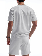Back view of light gray ModFlex set displaying shirt and short design.