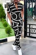 Men's black Drevion GeoSet Luxe short sleeve top and pants set front view on model.
