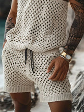Close-up of men’s plus size beige hollow out shorts — highlighting openwork detail, soft fabric, pocket detail, and drawstring waist.