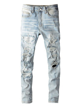 Front view of Droxen Distresslight™ Rhinestone Denim Jeans in light blue