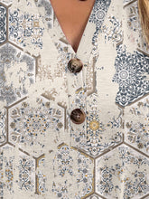 Close-up of half button-up and button  detail on dust storm Printed Short Sleeve Blouse.