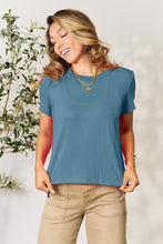 Model wearing Full Size Round Neck Short Sleeve T-Shirt in soft dusty blue