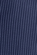 Close-up view of dusty blue Nolavelle mini dress fabric highlighting soft ribbed texture and precise stitching.
