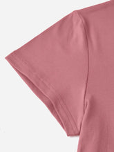 Close-up of CaliVista Tee’s shoulder seams and clean stitching on soft dusty pink fabric.