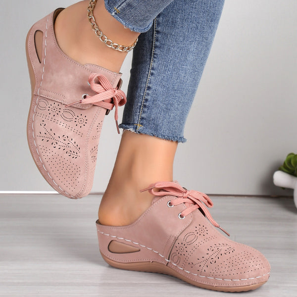 sides view of dusty pink Lace-Up Round Toe Wedge Sandals and a gold anklet and blue jeans.