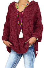 Model wearing the Wine color Tessyra Cable-Knit Hooded Sweater paired with jewelry and blue denim jeans.
