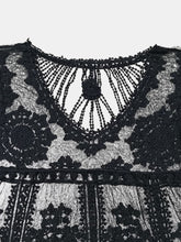 Close-up of V-neckline and delicate floral lace design on black Celévra Lace Round Neck Cover-Up Dress