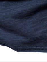 Close-up of stitched bottom hem detail on navy cotton round neck short sleeve tee