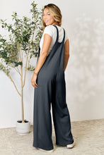 Back view of Cloudy Blue Cyrella Muse Overalls with adjustable wide straps visible.