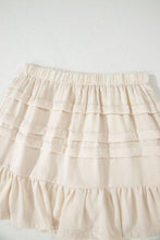 Close-up view of Elunari Mini Skirt’s elastic waistband, three-tier design, and ruffle hem detail