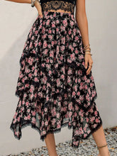 Close-up of Elurevyn black floral print lace midi skirt showing lace trim and lightweight layered fabric
