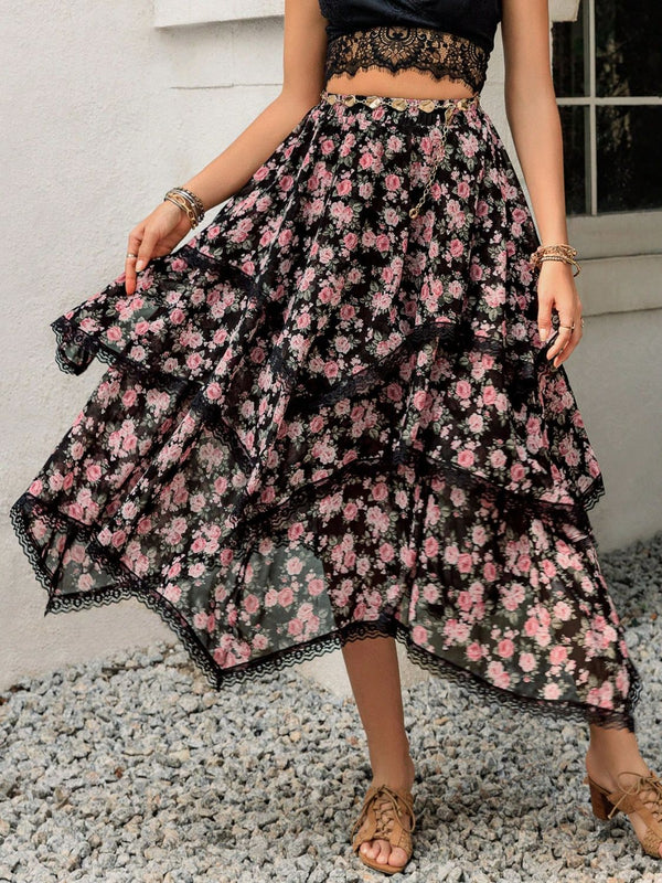 Elurevyn black floral print lace midi skirt styled with casual black blouse and heels