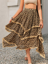 Elurevyn leopard print lace midi skirt styled with casual beige top and sandals
