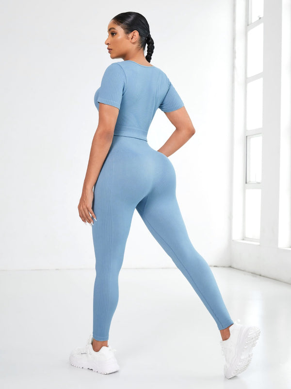 Back view of Light Blue EroVital Fusion Active Set during yoga asana in studio.