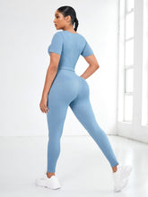 Back view of Light Blue EroVital Fusion Active Set during yoga asana in studio.