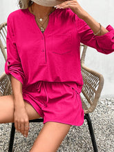 Model in hot pink Everyday Escape Lounge Set sitting in a chair laughing with friends at a weekend hangout.
