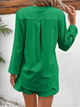 Back view of mid green two-piece casualwear outfit.