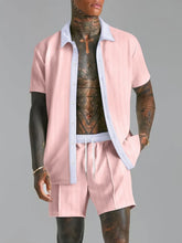 Blush pink Ezran ModeSet Luxe Duo men’s set — front view with open white contrast collar, textured fabric, adjustable waist, and creased shorts