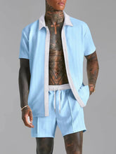 Pastel blue Ezran ModeSet Luxe Duo men’s set — front view with open white contrast collar, textured fabric, adjustable waist, and creased shorts