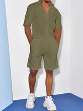 Man in army green short sleeve shirt and shorts set, front view with classic collar detail.