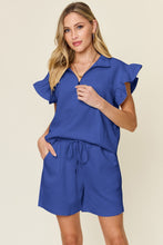 Model in royal blue Facts Only Fit Set paired with white sneakers for brunch vibes.