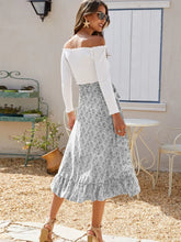 Back view of Faylora Drift Skirt in gray showing cascading ruffled hem and relaxed fit