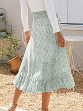 Back view of Faylora Drift Skirt in green showing cascading ruffled hem and relaxed fit