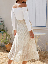 Back view of Faylora Drift Skirt in pastel yellow showing cascading ruffled hem and relaxed fit