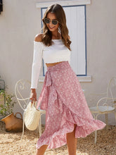 Side view of Faylora Drift Skirt dusty pink highlighting flowy low-high side ruffles and floral print