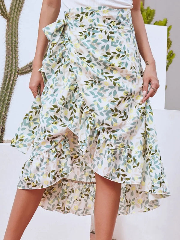 Faylora Drift Skirt front view in gum leaf botanical print with side tie waist and asymmetric ruffled hem