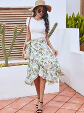 Full body styled look featuring Faylora Drift Skirt in gum leaf paired with white top, straw hat, sunglasses, crossbody bag, and black heels