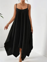 Model posing in the black Fleur De Flow Luxe scoop neck cami dress on the runway in Paris.