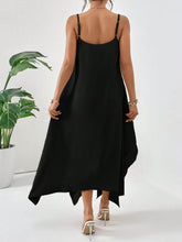 Model posing a back view of  black Fleur De Flow Luxe scoop neck cami dress.