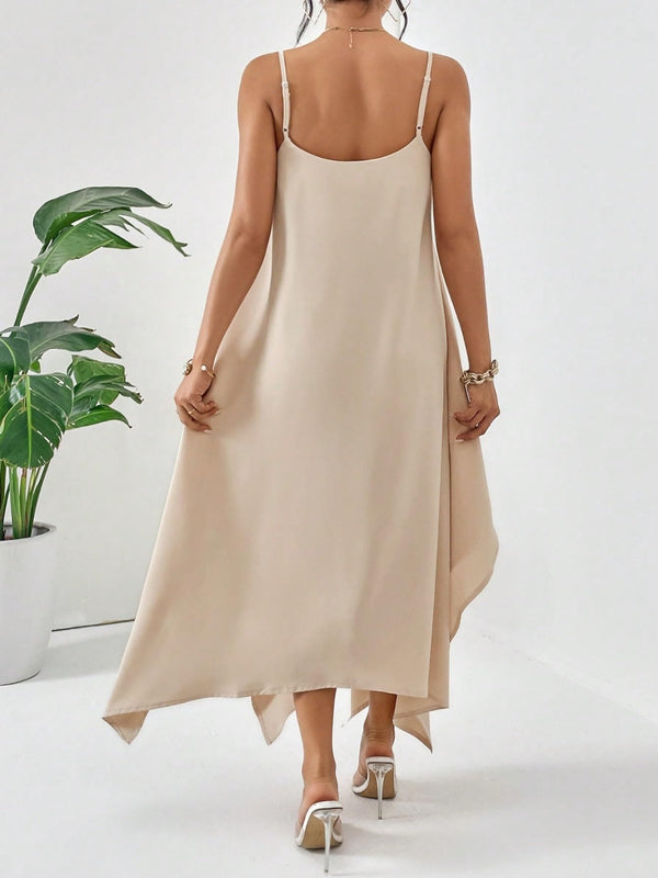 Model back view pose of the Fleur De Flow Luxe tan scoop neck cami dress.