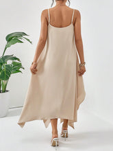 Model back view pose of the Fleur De Flow Luxe tan scoop neck cami dress.